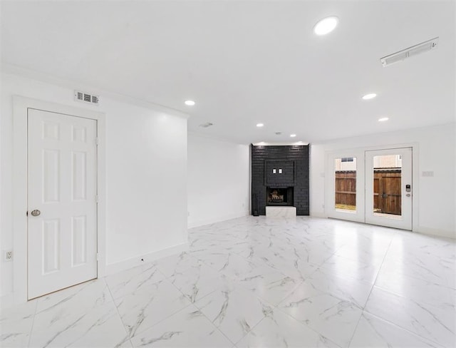 1691 W Sam Houston Pkwy S, Houston, TX 77042 - unfurnished living room with recessed lighting, a fireplace, and light marble finish flooring