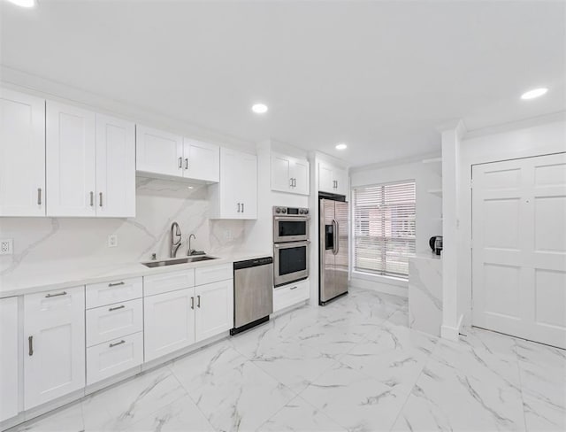 1691 W Sam Houston Pkwy S, Houston, TX 77042 - kitchen with stainless steel appliances, recessed lighting, white cabinets, light marble finish flooring, and light countertops