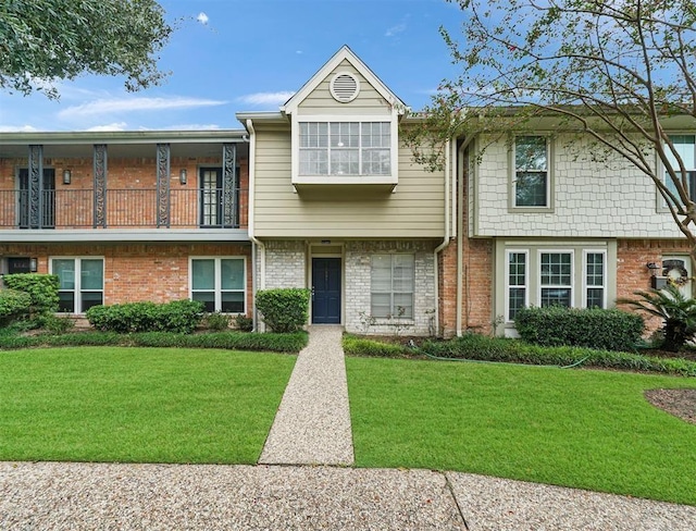 1691 W Sam Houston Pkwy S, Houston, TX 77042 - multi unit property featuring a front yard and brick siding
