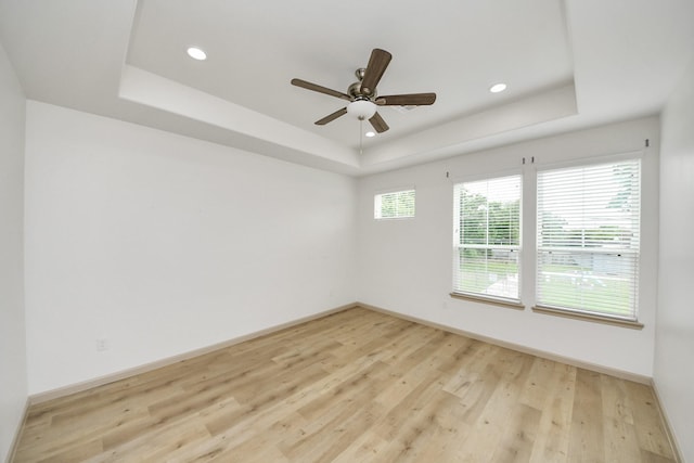 2119 Esther Dr, Houston, TX 77088 - spare room featuring a raised ceiling, wood finished floors, a ceiling fan, and recessed lighting