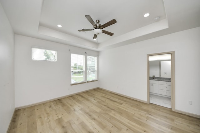 2119 Esther Dr, Houston, TX 77088 - unfurnished room with a tray ceiling, light wood-style flooring, a ceiling fan, a smoke detector, and recessed lighting