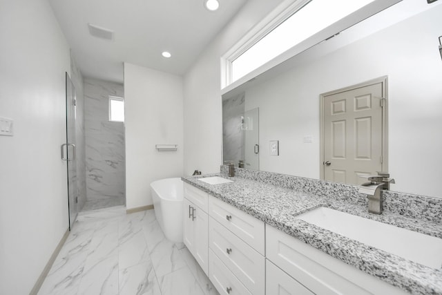 2119 Esther Dr, Houston, TX 77088 - full bath with marble look tile flooring, a marble finish shower, double vanity, a freestanding tub, and recessed lighting
