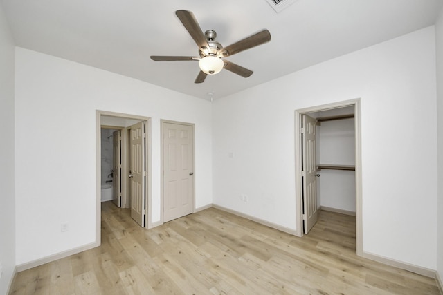 2119 Esther Dr, Houston, TX 77088 - unfurnished bedroom featuring light wood-style flooring, a spacious closet, a closet, and ceiling fan