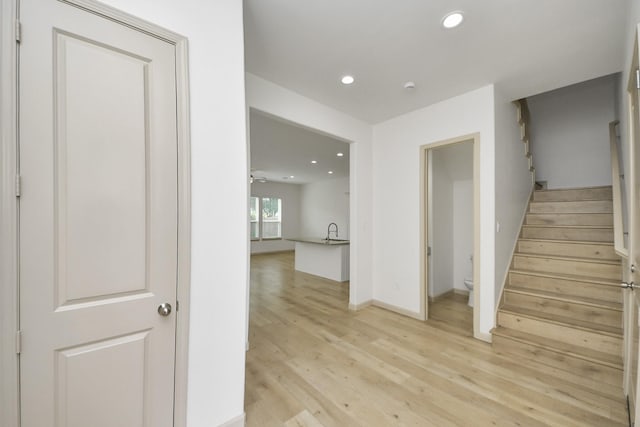 2119 Esther Dr, Houston, TX 77088 - stairs featuring recessed lighting and wood finished floors