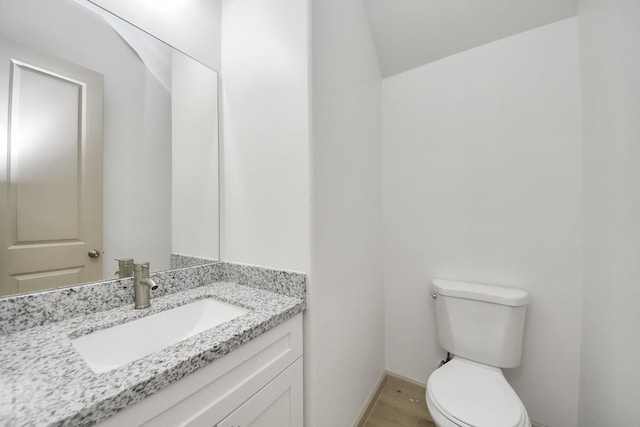 2119 Esther Dr, Houston, TX 77088 - half bathroom featuring vanity and wood finished floors