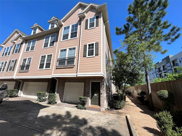 3001 Murworth Dr Unit 1603, Houston, TX 77025 - townhome / multi-family property featuring a garage, driveway, and brick siding