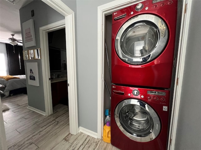 3001 Murworth Dr Unit 1603, Houston, TX 77025 - laundry area featuring stacked washer / drying machine, a ceiling fan, and wood finished floors