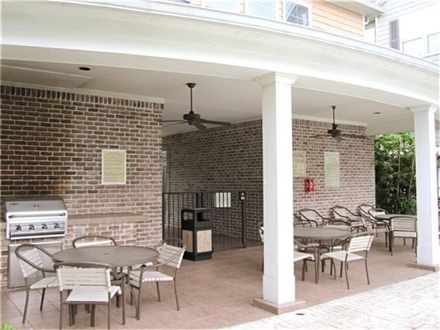 3001 Murworth Dr Unit 1603, Houston, TX 77025 - view of patio / terrace with outdoor dining area, a ceiling fan, and an outdoor kitchen