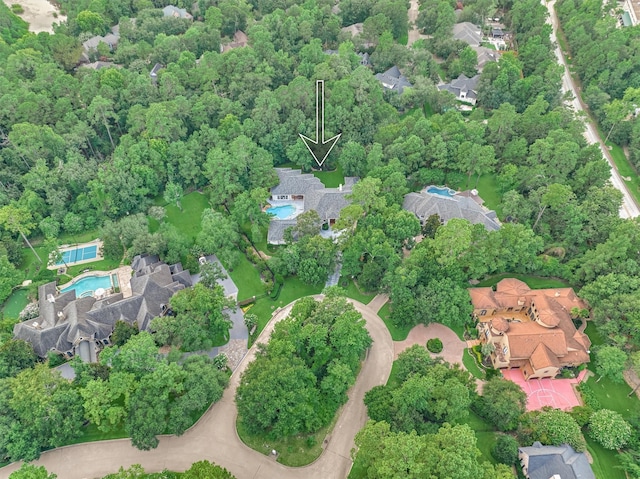 134 Trinity Oaks Ct, The Woodlands, TX 77381 - aerial view of property and surrounding area featuring a pool area