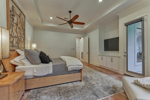 134 Trinity Oaks Ct, The Woodlands, TX 77381 - bedroom with a tray ceiling, ornamental molding, recessed lighting, access to outside, and a ceiling fan