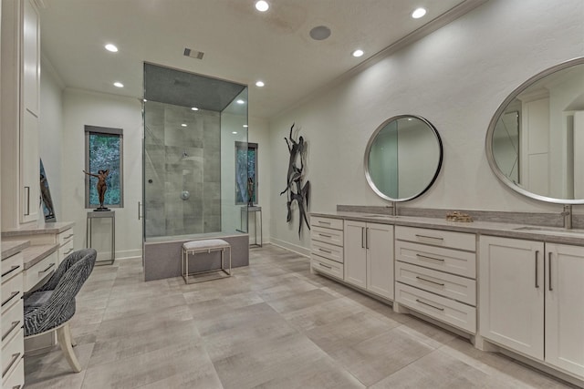134 Trinity Oaks Ct, The Woodlands, TX 77381 - full bath with double vanity, recessed lighting, ornamental molding, and a tile shower