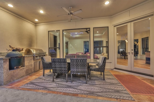 134 Trinity Oaks Ct, The Woodlands, TX 77381 - view of patio / terrace featuring french doors, an outdoor kitchen, ceiling fan, and outdoor dining area
