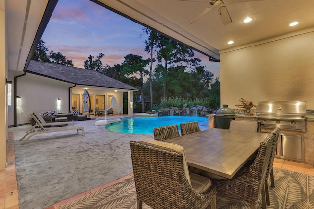 134 Trinity Oaks Ct, The Woodlands, TX 77381 - outdoor pool with an outdoor kitchen, ceiling fan, a patio, and outdoor dining space
