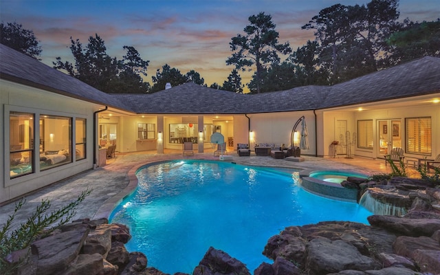 134 Trinity Oaks Ct, The Woodlands, TX 77381 - pool at dusk with a patio area and a pool with connected hot tub