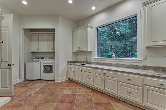 134 Trinity Oaks Ct, The Woodlands, TX 77381 - washroom with independent washer and dryer, cabinet space, and recessed lighting