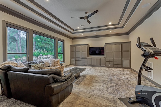 134 Trinity Oaks Ct, The Woodlands, TX 77381 - living room with crown molding, a raised ceiling, ceiling fan, carpet flooring, and recessed lighting