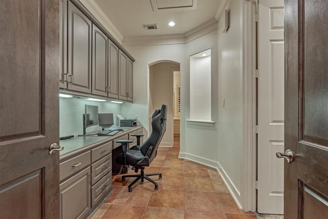 134 Trinity Oaks Ct, The Woodlands, TX 77381 - office area featuring built in study area, ornamental molding, and arched walkways