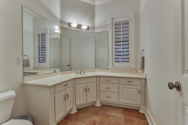 134 Trinity Oaks Ct, The Woodlands, TX 77381 - bathroom featuring crown molding, vanity, and tile patterned floors