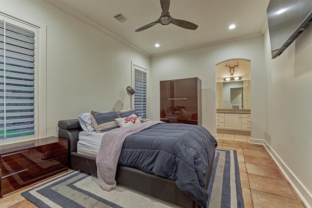 134 Trinity Oaks Ct, The Woodlands, TX 77381 - bedroom with ornamental molding, ensuite bath, ceiling fan, recessed lighting, and light tile patterned flooring