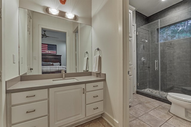 134 Trinity Oaks Ct, The Woodlands, TX 77381 - ensuite bathroom with a stall shower, vanity, and ceiling fan