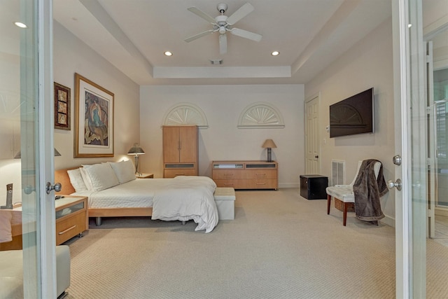 134 Trinity Oaks Ct, The Woodlands, TX 77381 - bedroom with french doors, carpet floors, recessed lighting, a raised ceiling, and ceiling fan