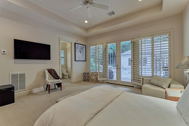 134 Trinity Oaks Ct, The Woodlands, TX 77381 - bedroom with access to outside, a raised ceiling, carpet floors, recessed lighting, and ensuite bath