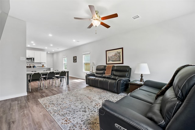 16934 Needlepoint Dr, Conroe, TX 77302 - living room featuring ceiling fan, wood finished floors, and recessed lighting