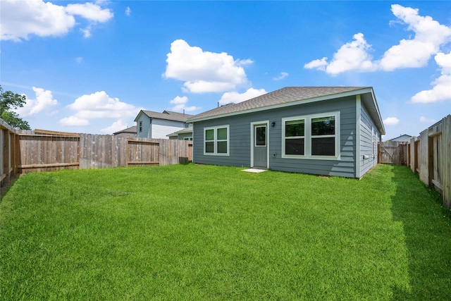 16934 Needlepoint Dr, Conroe, TX 77302 - rear view of house with a fenced backyard and a shingled roof