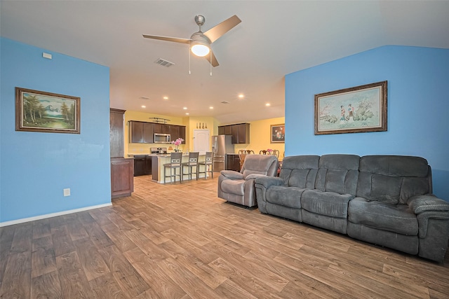 22618 Cremona Village Trl, Katy, TX 77449 - living area with ceiling fan, light wood finished floors, and recessed lighting