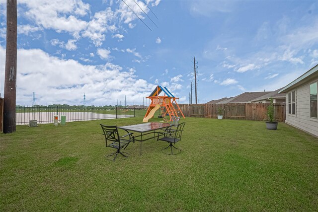 22618 Cremona Village Trl, Katy, TX 77449 - fenced backyard featuring a playground