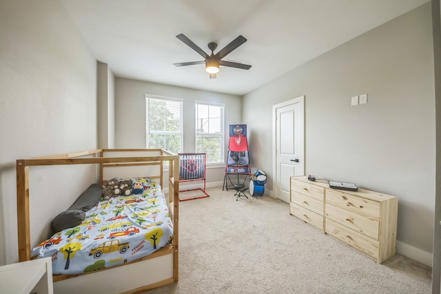6524 Couch St, Houston, TX 77091 - carpeted bedroom with baseboards and ceiling fan