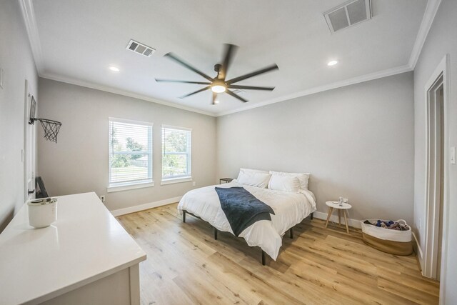 6524 Couch St, Houston, TX 77091 - bedroom featuring ornamental molding, light wood-type flooring, recessed lighting, and a ceiling fan