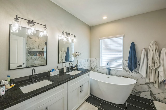 6524 Couch St, Houston, TX 77091 - bathroom with a freestanding bath, double vanity, a marble finish shower, and tile patterned flooring