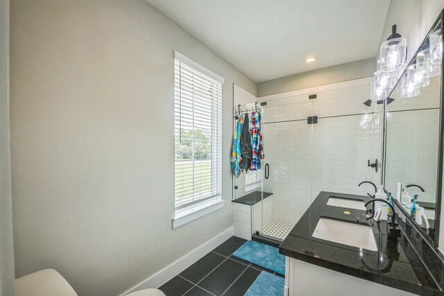 6524 Couch St, Houston, TX 77091 - full bath featuring a shower stall, tile patterned flooring, and double vanity