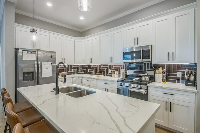 6524 Couch St, Houston, TX 77091 - kitchen featuring stainless steel appliances, white cabinetry, backsplash, decorative light fixtures, and recessed lighting