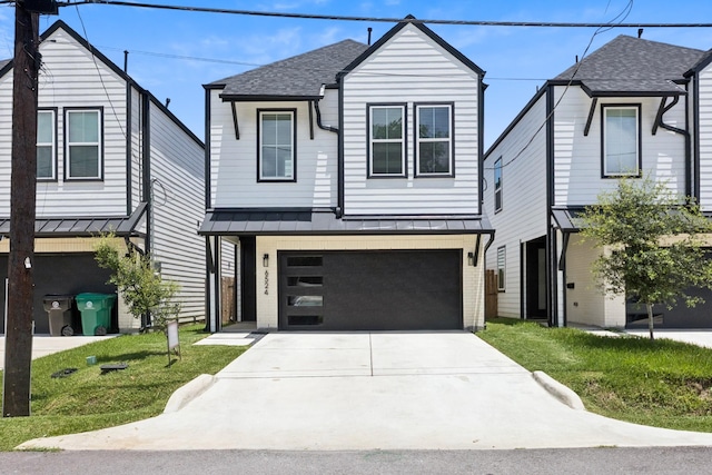6524 Couch St, Houston, TX 77091 - traditional-style house with concrete driveway, an attached garage, a standing seam roof, a shingled roof, and a front lawn