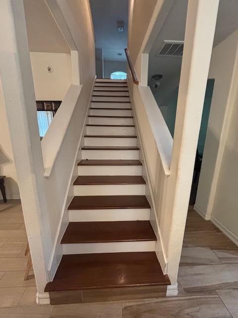 7126 Grants Hollow Ln, Richmond, TX 77407 - stairway with baseboards