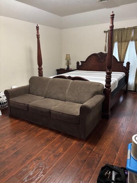 7126 Grants Hollow Ln, Richmond, TX 77407 - bedroom featuring wood-type flooring