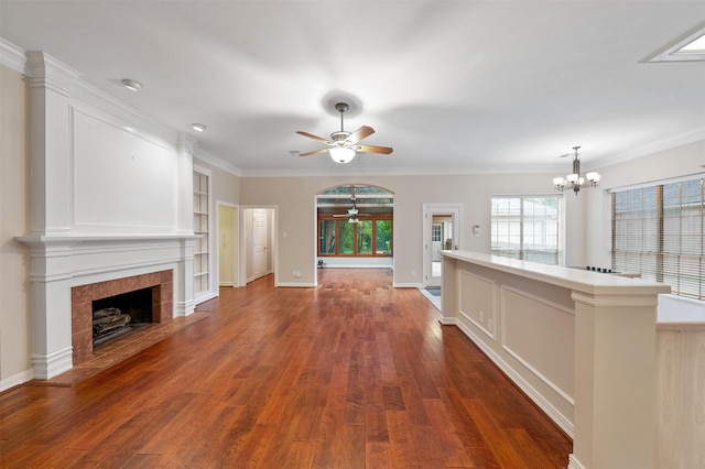11603 Orchard Mountain Dr, Houston, TX 77059 - unfurnished living room with a ceiling fan, a tile fireplace, a chandelier, dark wood-style flooring, and built in shelves