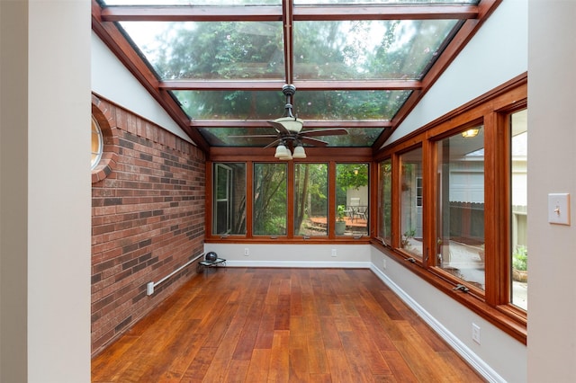 11603 Orchard Mountain Dr, Houston, TX 77059 - unfurnished sunroom featuring brick wall, lofted ceiling, healthy amount of natural light, wood-type flooring, and a skylight