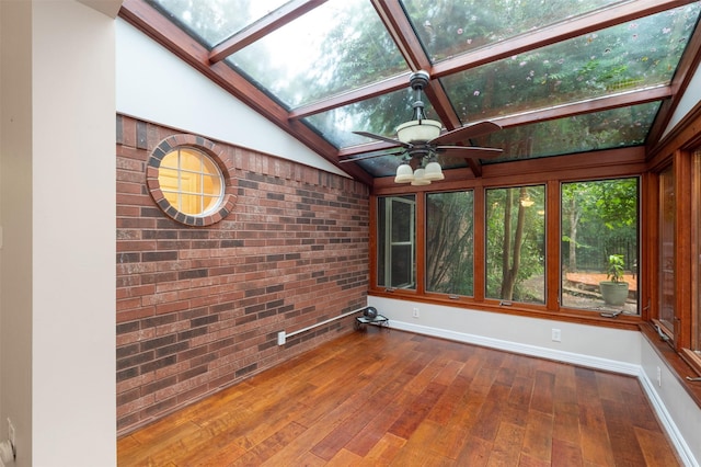 11603 Orchard Mountain Dr, Houston, TX 77059 - unfurnished sunroom featuring a skylight, brick wall, wood-type flooring, and vaulted ceiling