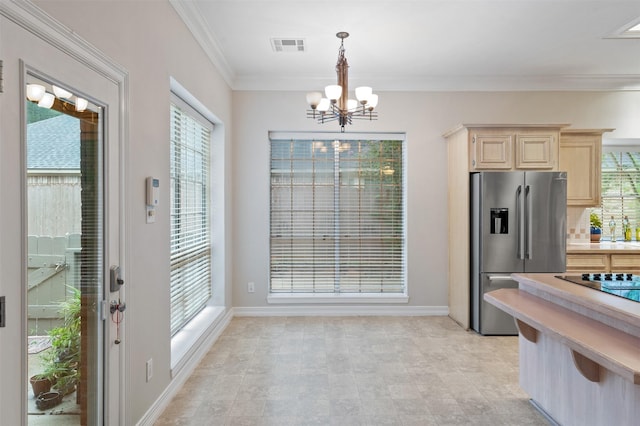 11603 Orchard Mountain Dr, Houston, TX 77059 - kitchen with stainless steel fridge with ice dispenser, a chandelier, light countertops, light brown cabinets, and healthy amount of natural light
