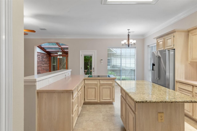 11603 Orchard Mountain Dr, Houston, TX 77059 - kitchen featuring stainless steel fridge with ice dispenser, light brown cabinets, a center island, a ceiling fan, and a chandelier