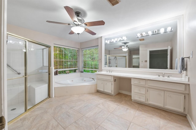 11603 Orchard Mountain Dr, Houston, TX 77059 - bathroom with double vanity, ceiling fan, a jetted tub, and a stall shower