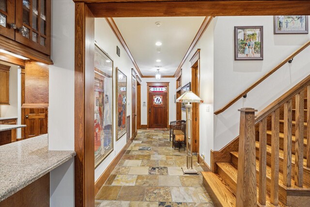 4132 Coleridge St, West University Place, TX 77005 - foyer entrance with stone tile floors, stairway, and ornamental molding