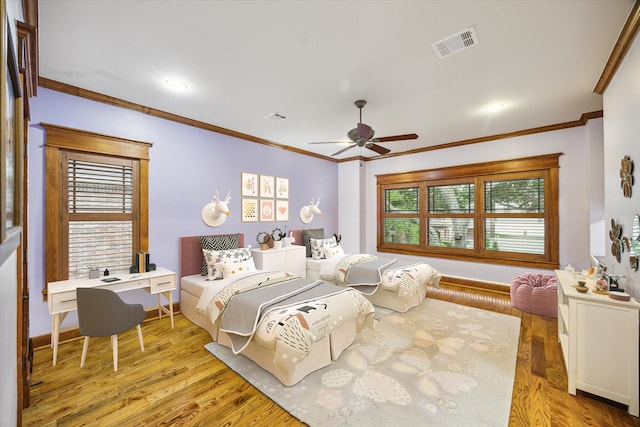 4132 Coleridge St, West University Place, TX 77005 - bedroom featuring crown molding, light wood-style flooring, and ceiling fan
