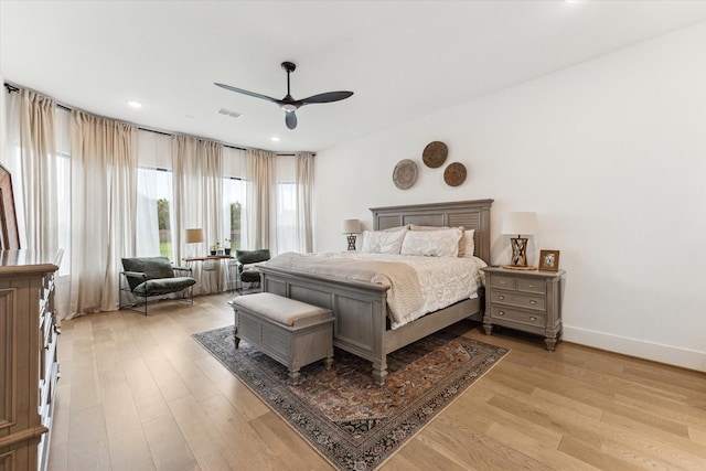 15714 Park Poetry Ct, Cypress, TX 77433 - bedroom with light wood finished floors, ceiling fan, and recessed lighting