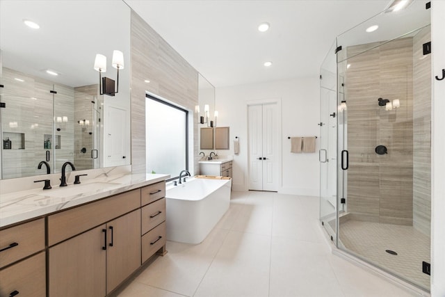 15714 Park Poetry Ct, Cypress, TX 77433 - bathroom featuring vanity, a shower stall, tile patterned flooring, a freestanding tub, and recessed lighting