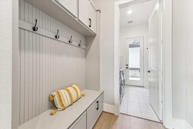 15714 Park Poetry Ct, Cypress, TX 77433 - mudroom with separate washer and dryer and light wood-style floors