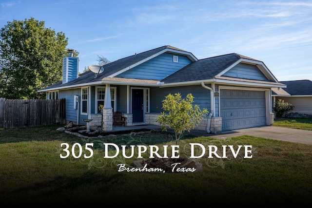 305 Duprie Dr, Brenham, TX 77833 - view of front of home featuring a porch, a chimney, an attached garage, concrete driveway, and a shingled roof